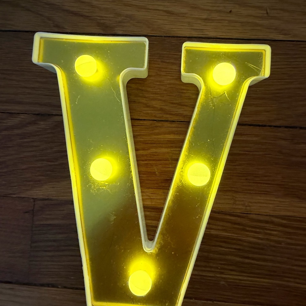 Source Unknown Yellow Letter V Light